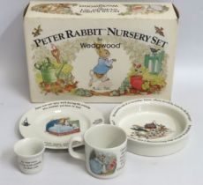 A boxed Wedgwood Peter Rabbit four piece nursery set