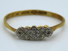 An antique 18ct gold ring set with platinum mounte