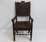 A 19thC. African oak throne chair, profusely carve