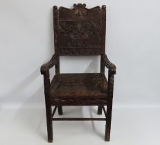 A 19thC. African oak throne chair, profusely carve