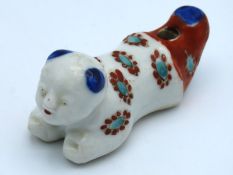 A 19thC. Japanese porcelain whistle with enamelled
