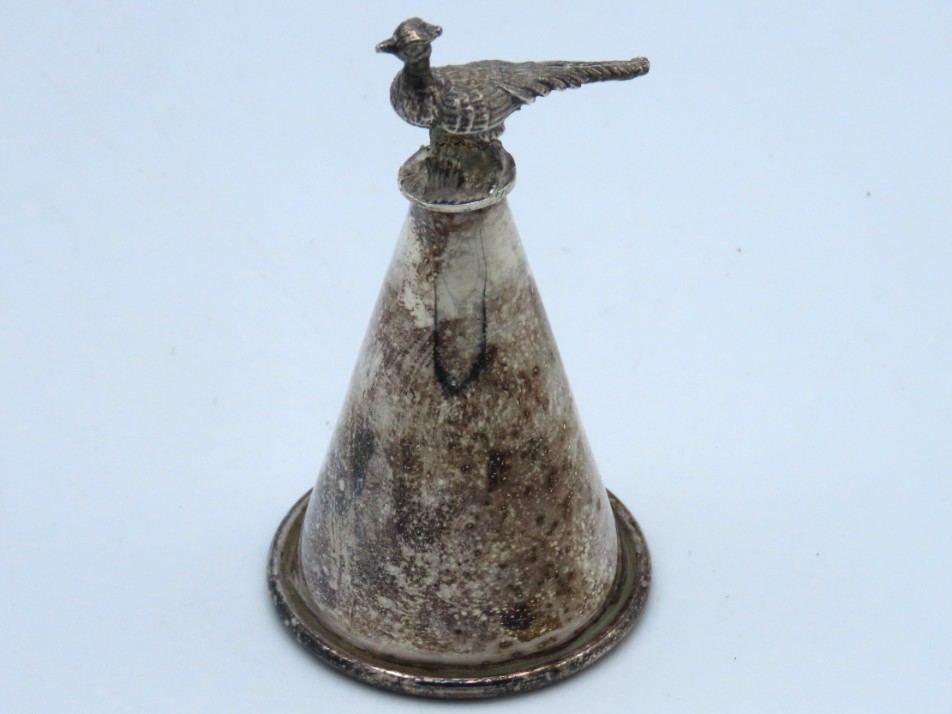 A silver plated candle snuffer with pheasant finia
