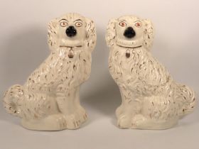A pair of Victorian Staffordshire pottery spaniels