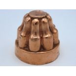 An antique copper mould, 54mm tall
