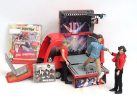 A 'One Direction' tour bus with three figures & du