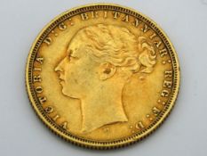 An 1873 22ct gold full gold sovereign, young head