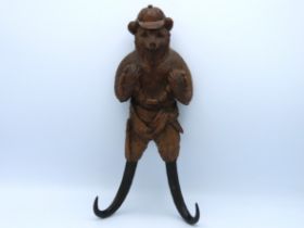 A late 19thC. German carved Black Forest whip hook