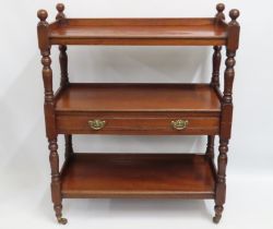 A Victorian mahogany three tier buffet trolley wit