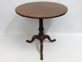 A 19thC. mahogany tilt top pedestal table, 700mm t