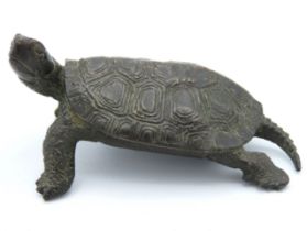 An antique, Oriental bronze tortoise, stamped to u