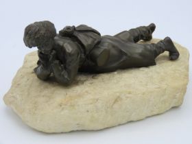 A 20thC. bronze of Russian Cossack on alabaster pl