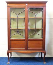 A 19thC. mahogany display cabinet with glazed door