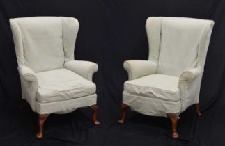 Pair of loose covered wing armchairs
