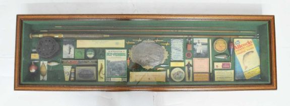 Cased fishing memorabilia in frame