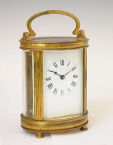 French gilt metal oval carriage timepiece