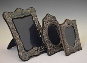 Three silver-mounted photo frames