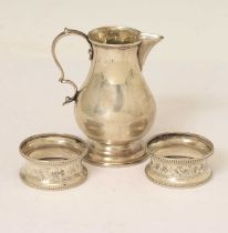 Victorian silver sparrow beak cream jug, and a pair of George V silver napkin rings