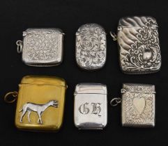 Four late 19th/early 20th century silver vestas, etc