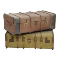 Two large canvas and wooden bound travel trunks