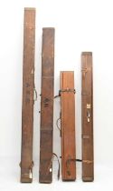 Four mahogany and tin-mounted fishing rod boxes/cases