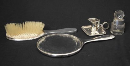Edward VII silver chamber stick, silver mounted perfume bottle, and two-piece dressing table set