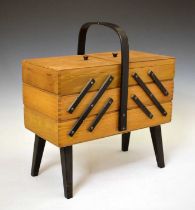Late 20th century cantilever sewing box standing on four tapered leg.