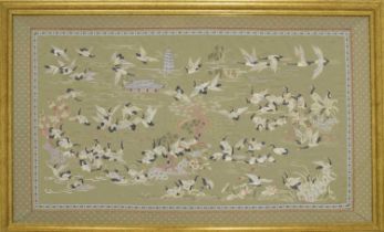 Large modern Chinese silk of a landscape depicting cranes in flight