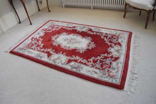 Chinese claret ground wool rug
