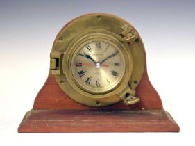 Ships Time clock in a porthole style mount