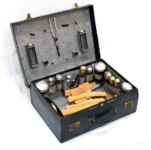 Morocco vanity case retailed by Edwards & Sons, containing silver-capped jars