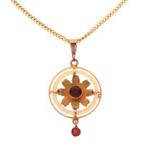 Pendant depicting a flower with two faceted red stones