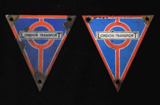 Two triangular-shaped enamel London Transport bus radiator badges
