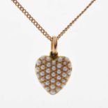 Yellow metal heart shaped pendant set seed pearls