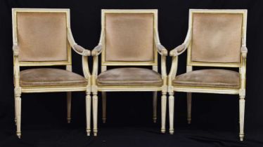 Group of three 20th century French cream painted and parcel gilt open armchairs