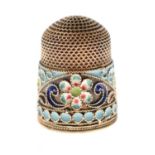 Russian white metal thimble with an enamel band of floral decoration