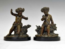 Pair of bronze figures of putti in the manner of Claude Michel Clodin