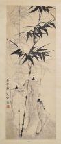 Chinese watercolour scroll painting depicting bamboo with landscape behind