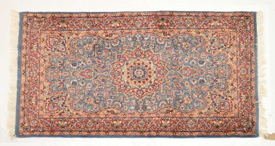 Middle Eastern blue and red ground wool rug