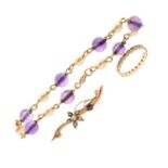 '9ct' yellow metal seed pearl and purple stone set bar brooch