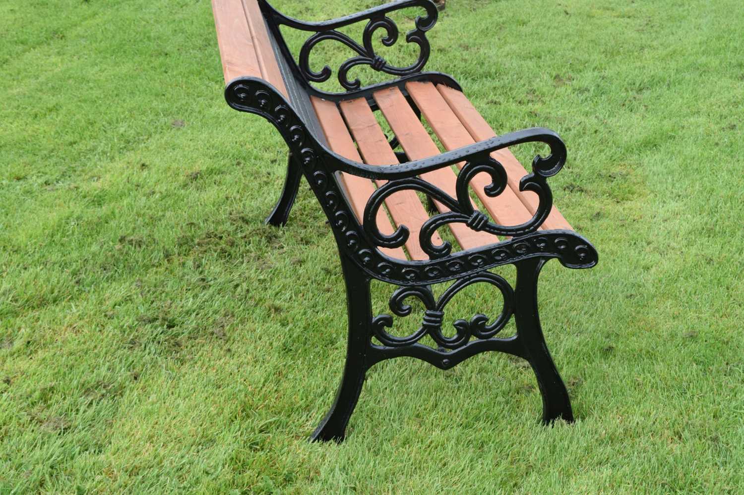 Modern two seater teak garden bench with cast metal ends - Image 4 of 6