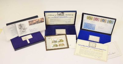 Three Danbury Mint silver commemorative stamp sets