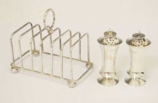 Pair of George V silver pepperettes, and silver toast rack