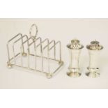 Pair of George V silver pepperettes, and silver toast rack