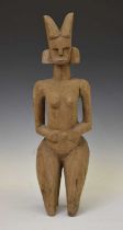 African carved wooden kneeling fertility figure