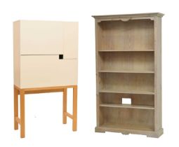 Modern compact desk , together with a lime-washed open bookcase