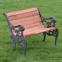 Garden seat having scroll decorated ends with metal lion heads