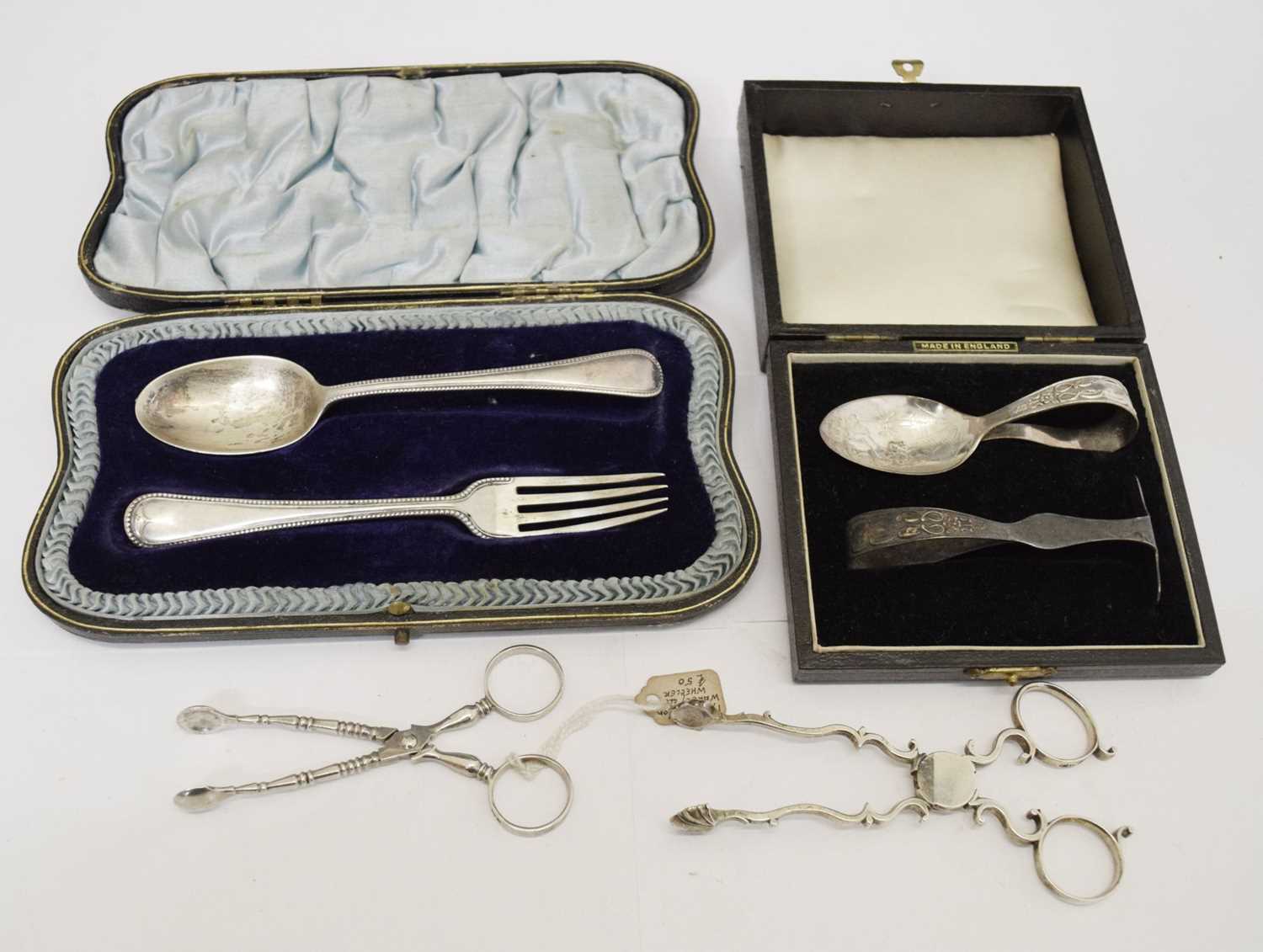 Pair of 18th century silver sugar nips, two cased silver Christening sets, etc