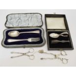 Pair of 18th century silver sugar nips, two cased silver Christening sets, etc