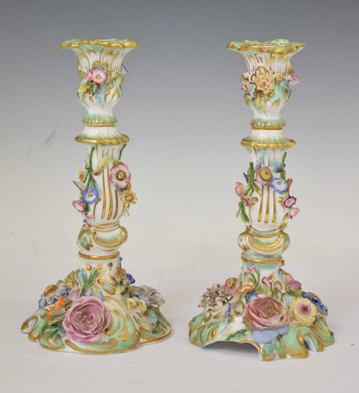 Pair of early 20th century Continental flower-encrusted candlesticks