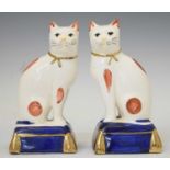 Pair of Staffordshire style seated cats